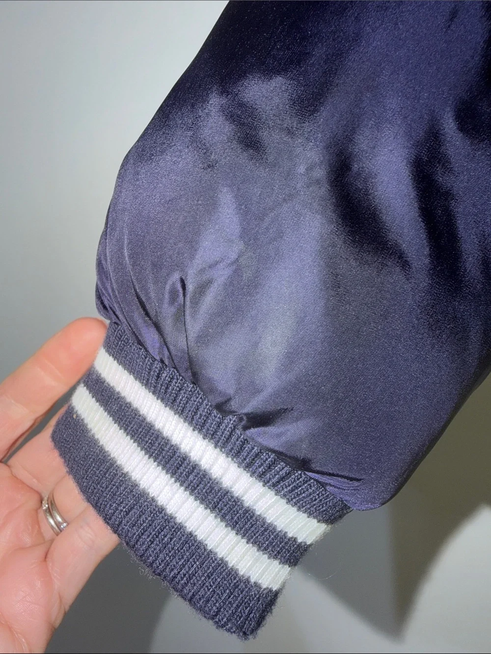 Rothschild Kids varsity puffer jacket features a navy blue puffer body 4T